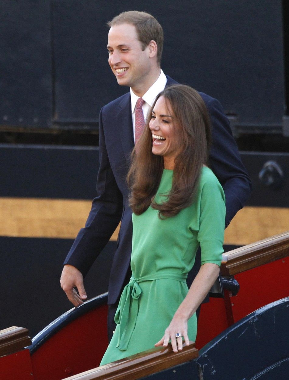 Prince William and his wife Catherine, the Duchess of Cambridge, laugh as they leave a drinks reception on the royal yacht Brittania in Edinburgh