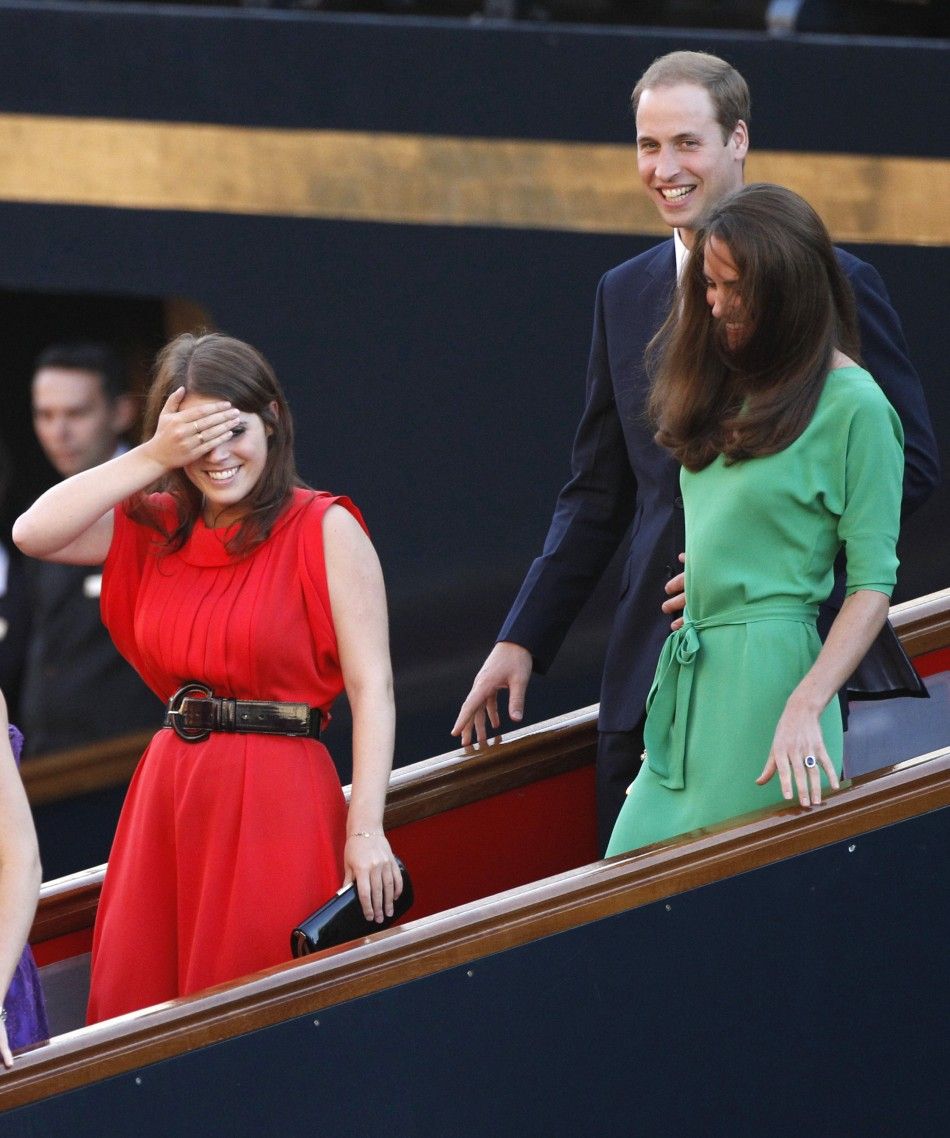 Britains Princess Eugenie gestures as she, Prince William and his wife Catherine, Duchess of Cambridge leave drinks reception on royal yacht Brittania in Edinburgh