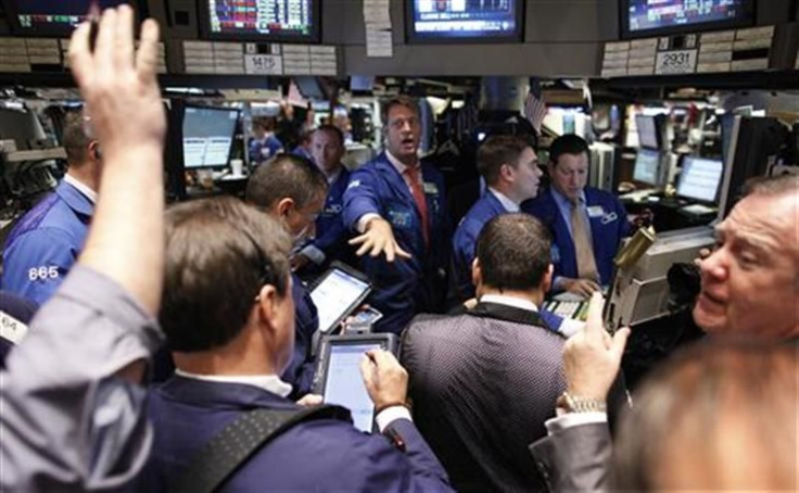 Traders work on the floor of the New York Stock Exchange.