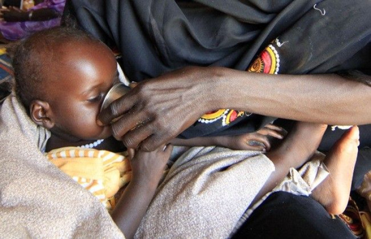 A sick internally displaced child drinks water at a health clinic during U.N. Under-Secretary-General for Humanitarian Affairs and Emergency Relief Coordinator Valerie Amos' visit to Al Salam IDPs camp at Al-Fasher in North Darfur November 7, 2010.