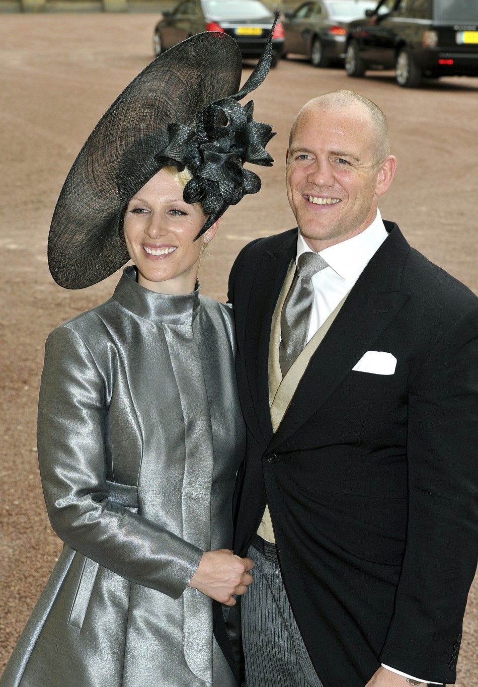 Britains Zara Phillips and her fiance Mike Tindall leave the wedding reception for Prince William and his wife Catherine, Duchess of Cambridge, at the Buckingham Palace in London