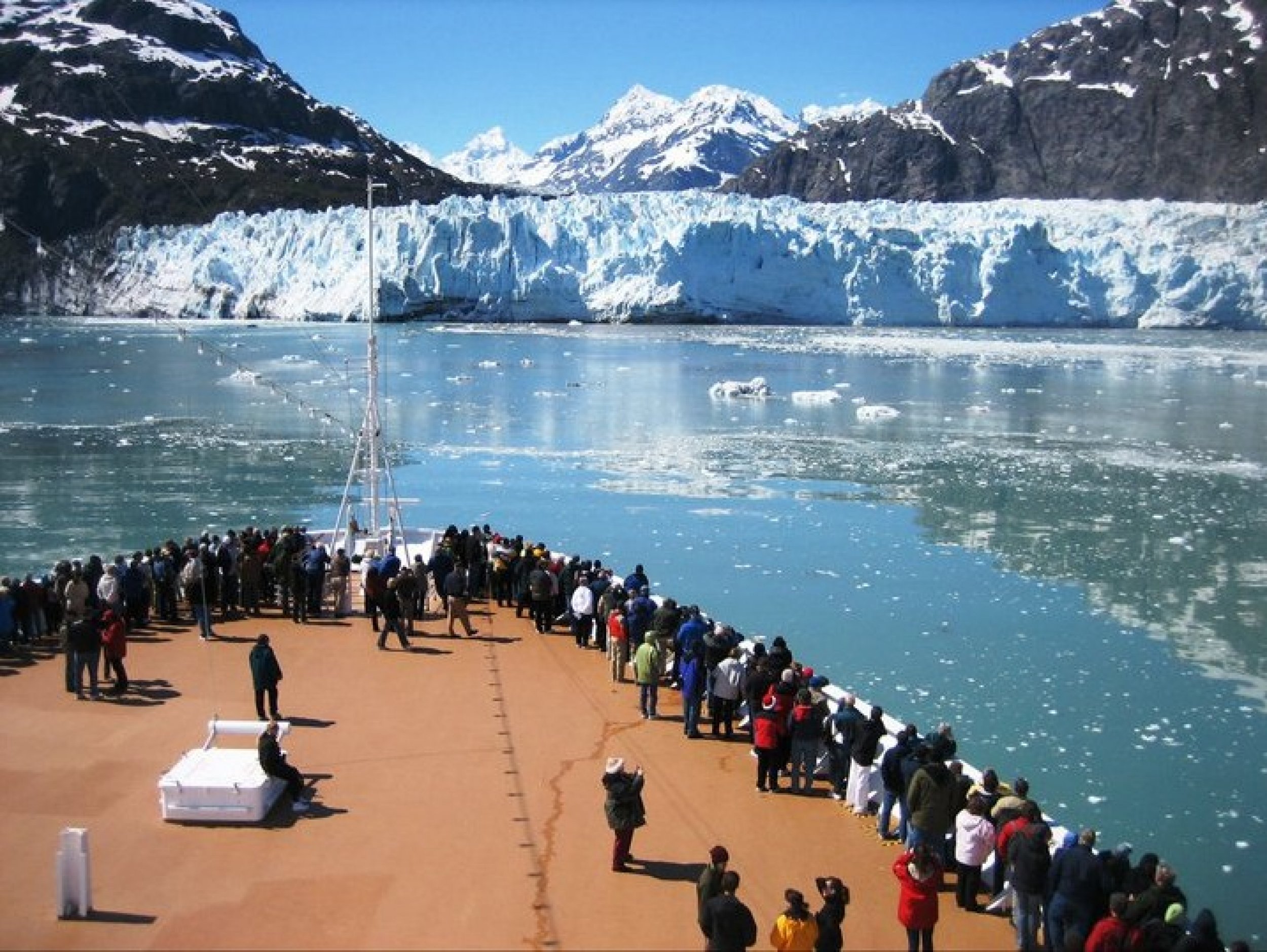 Visitors on a cruise ship experiencing their first glacier
