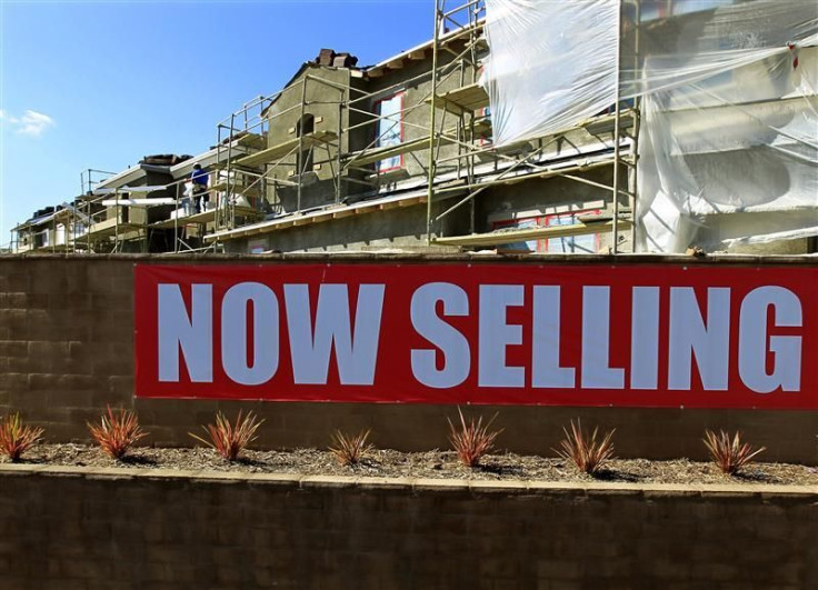 Construction workers continue work on a new subdivision of homes in San Marcos, California