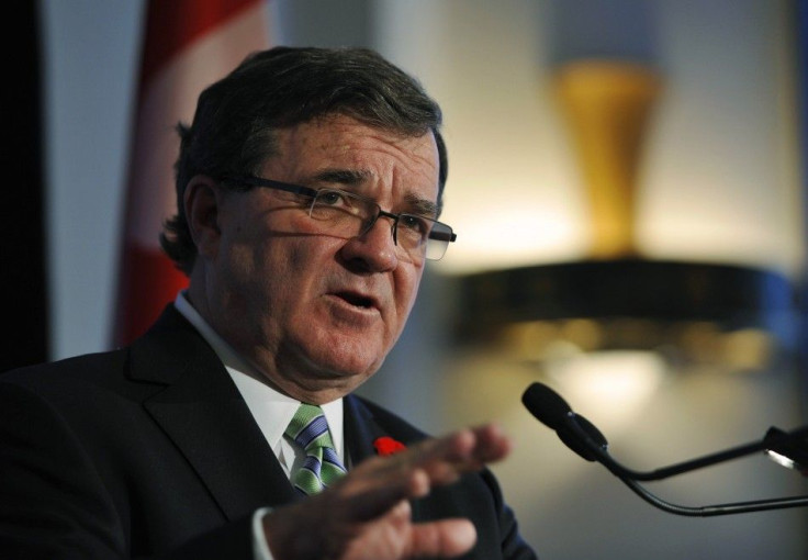 Canadian Finance Minister Flaherty answers questions at a news conference at the Calgary Chamber of Commerce in Calgary