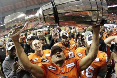 BC Lions wide receiver Bruce holds the Grey Cup after the Lions defeated the Winnipeg Blue Bombers to win the CFL&#039;s 99th Grey Cup football game in Vancouver