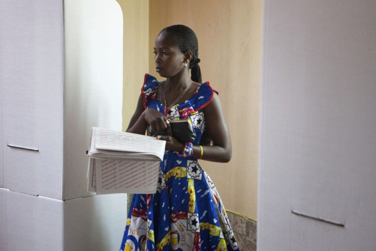 A woman casts her ballot at a polling station in Congo's capital Kinshasa