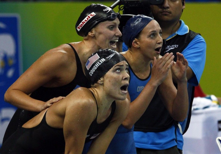 Coughlin, Vollmer and Soni of U.S. cheer on their teammate Franklin during women&#039;s 4 X 100m medley relay final at 14th FINA World Championships in Shanghai