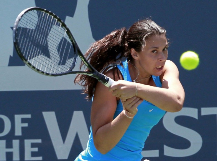 France&#039;s Bartoli returns the ball against Japan&#039;s Morita during their Stanford Classic tennis match in Stanford