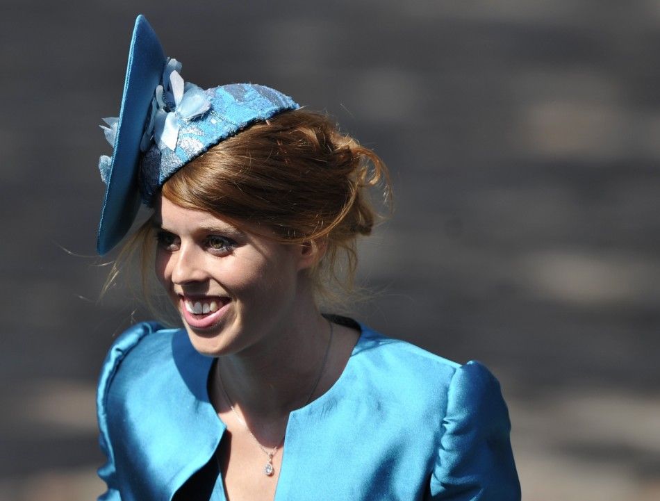 Britains Princess Beatrice arrives before the marriage of Zara Phillips, the eldest granddaughter of Queen Elizabeth, and England rugby captain Mike Tindall, at Canongate Kirk in Edinburgh, Scotland, July 30, 2011. 