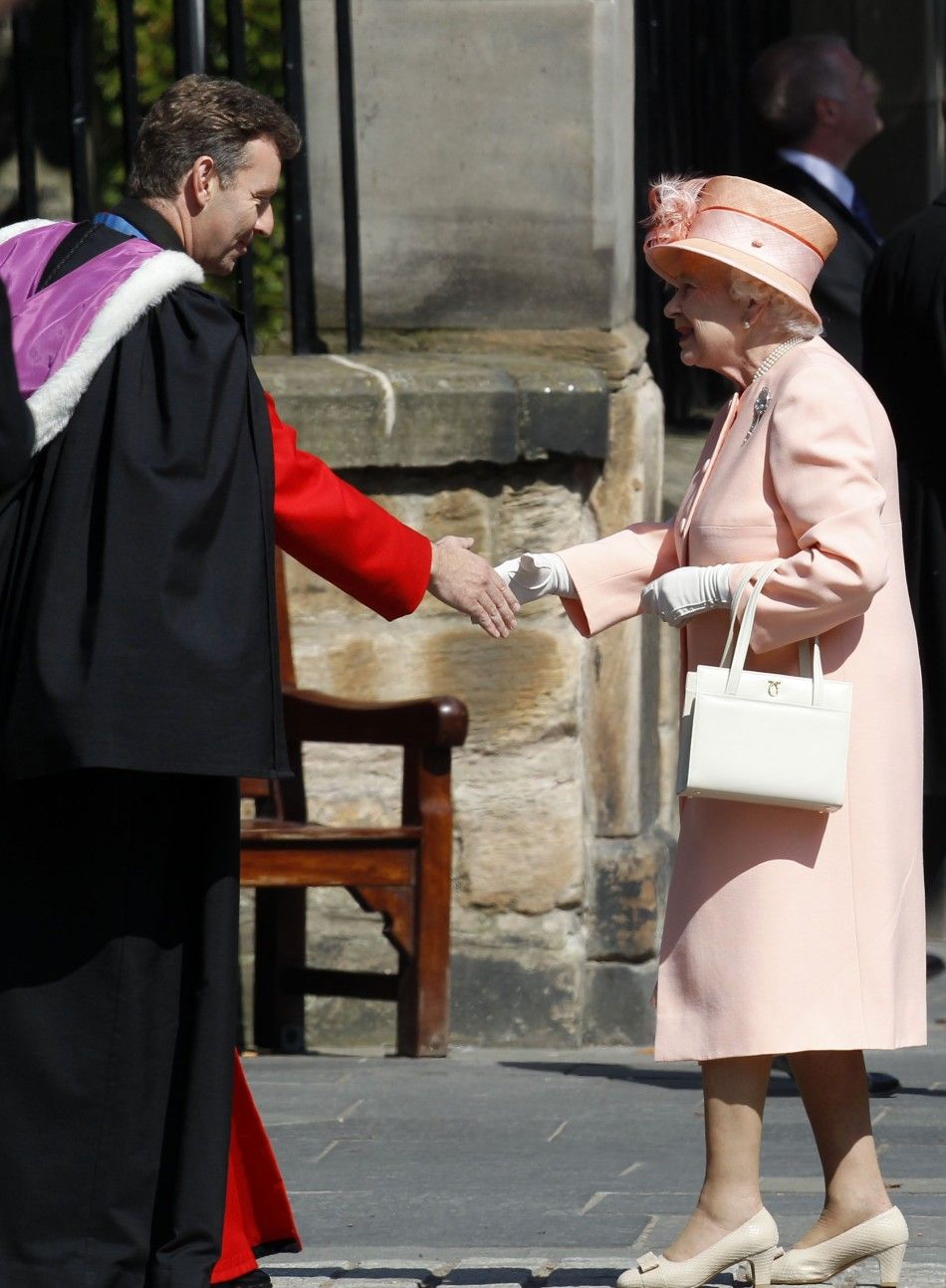 Reverend Neil Gardner greets Britains Queen Elizabeth