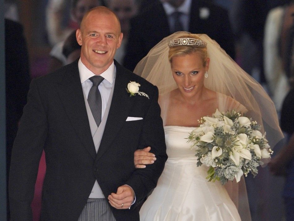  Britains Zara Phillips and her husband Mike Tindall leave after their marriage at Canongate Kirk in Edinburgh