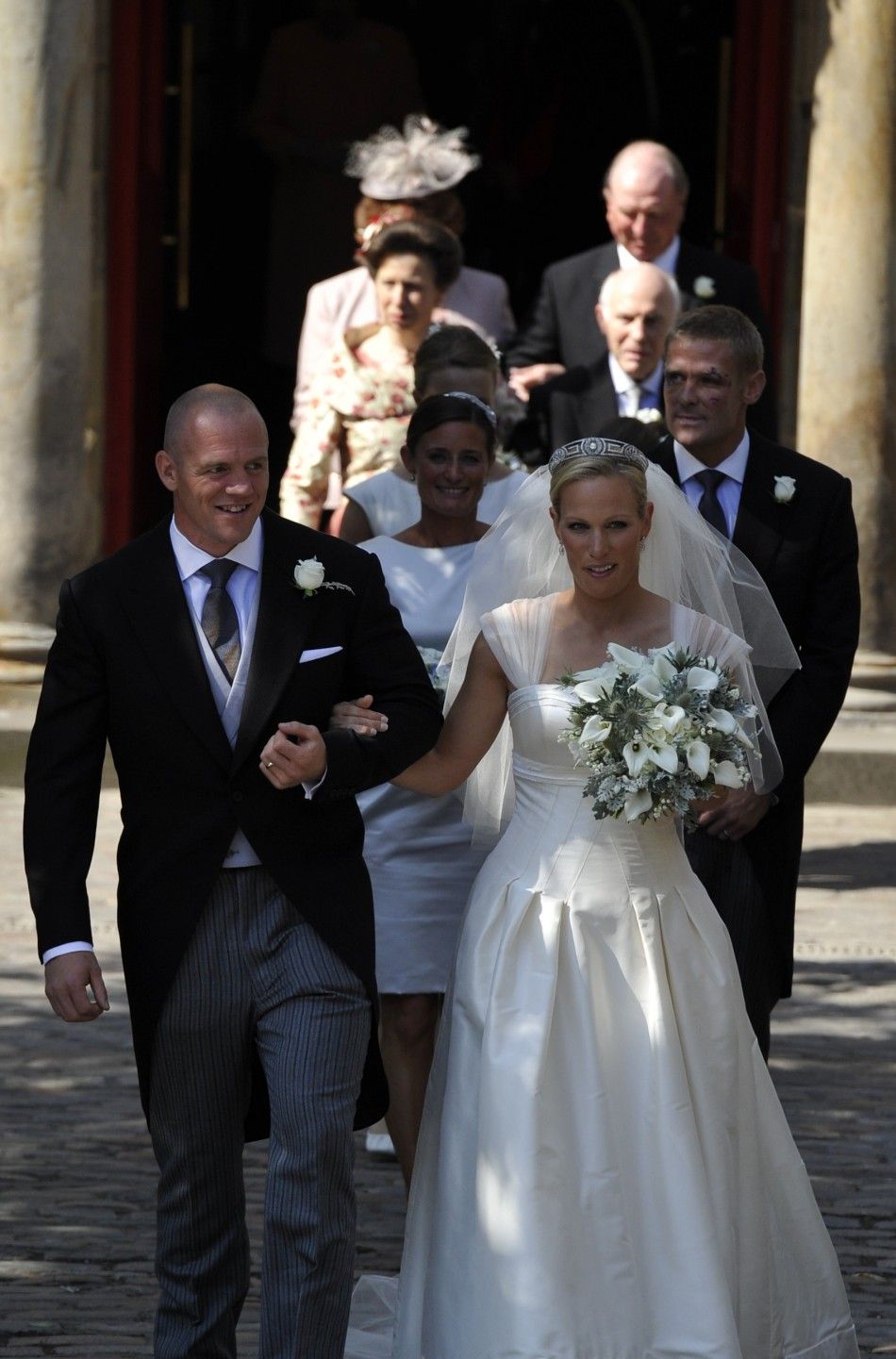 Britains Zara Phillips and her husband England rugby captain Mike Tindall leave the church after their marriage at Canongate Kirk in Edinburgh