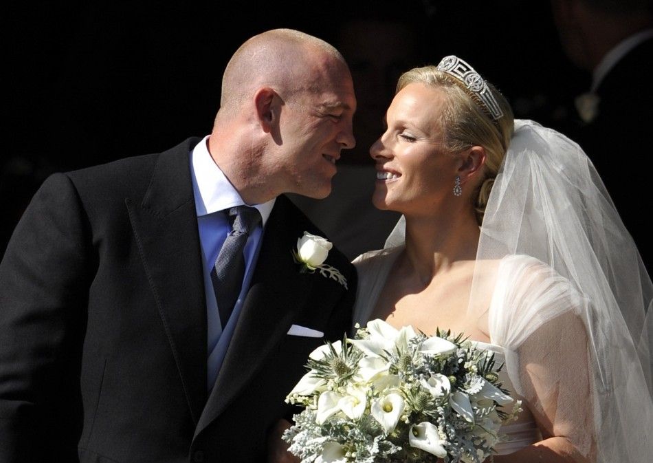 Britains Zara Phillips prepares to kiss her husband Mike Tindall after their marriage at Canongate Kirk in Edinburgh