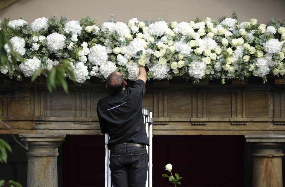  Workers put the finishing touches to Canongate Kirk before the marriage of Britains Zara Phillips and Mike Tindall in Edinburgh