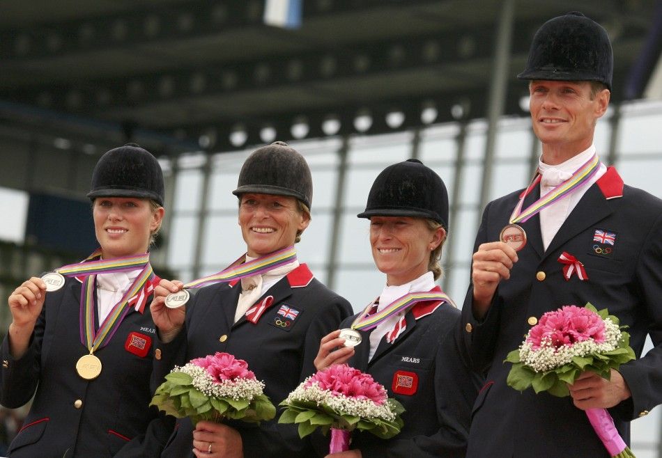 Britains Eventing team L-R Zara Phillips, Mary King , Daisy Dick and William Fox Pix stand on the podium showing their Eventing Silver medals at the World Equestrian Games in Aachen 