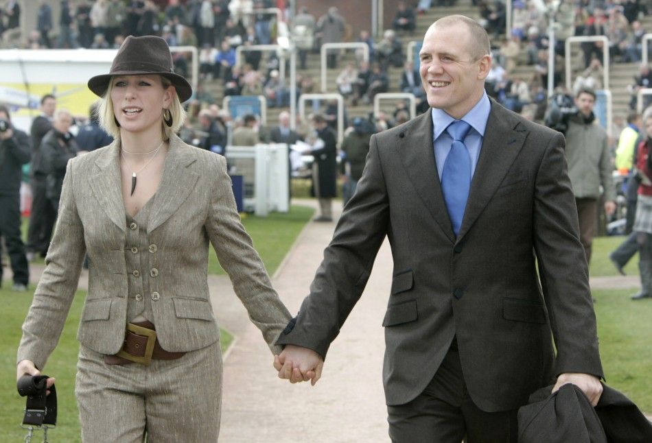 Britains royal and equestrian rider Zara Phillips L arrives with her boyfriend, Rugby Union player Mike Tindall, on the third day of the Cheltenham Festival horse racing in Gloucestershire, western England