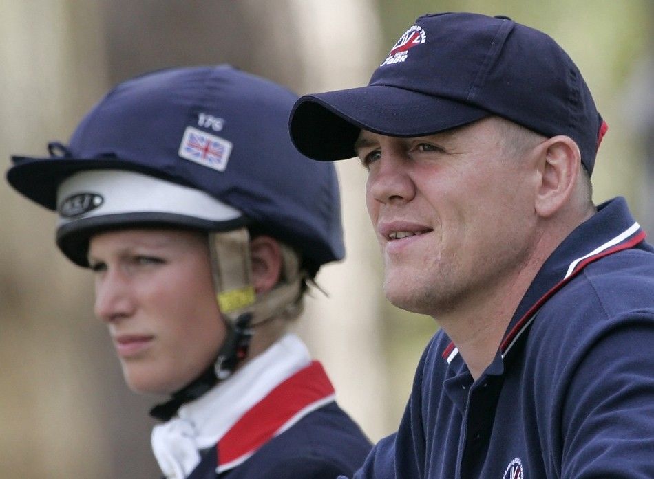 Mike Tindall and his girlfriend Zara Phillips, granddaughter of Queen Elizabeth, watch before her performance in the Jump starters during the European Equestrian Championship at the Pratoni Del Vivaro in southern Rome 