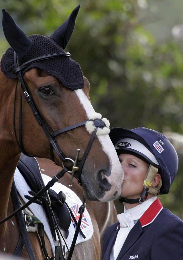 Zara Phillips, granddaughter of Queen Elizabeth, kisses her horse Toytown before her performance in the Jump starters during the European Equestrian Championship at the Pratoni Del Vivaro in southern Rome 