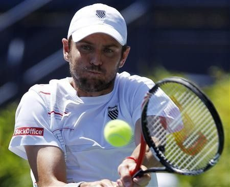 Mardy Fish of the U.S. hits a backhand to compatriot Ryan Harrison during the semi-finals of the ATP Los Angeles International tennis open tournament in Los Angeles, California