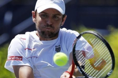 Mardy Fish of the U.S. hits a backhand to compatriot Ryan Harrison during the semi-finals of the ATP Los Angeles International tennis open tournament in Los Angeles, California