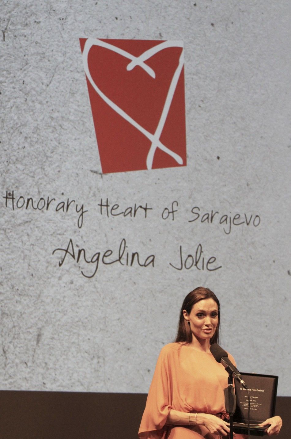 Angelina Jolie speaks after receiving the Heart of Sarajevo award during the 17th Sarajevo film festival in Sarajevo
