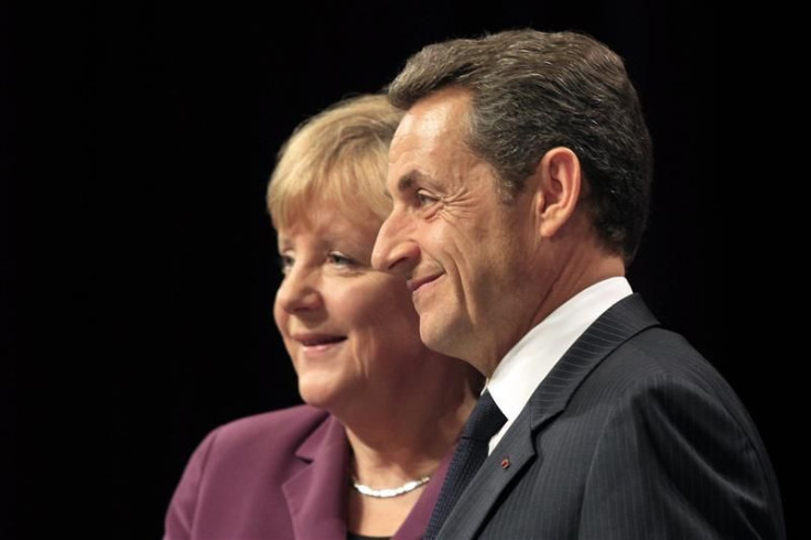 France's President Nicolas Sarkozy (R) and Germany's Chancellor Angela Merkel attend a joint press conference on the eve of a G20 summit of major world economies in Cannes