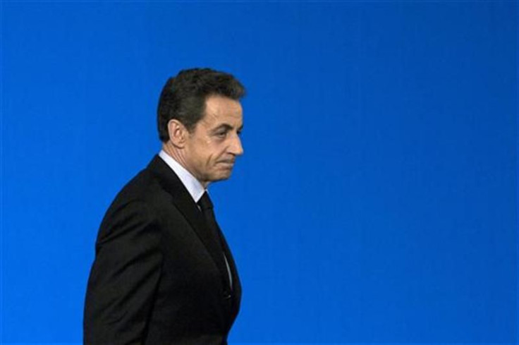 France&#039;s President Sarkozy walks on stage at a ceremony for winners of the competition for the Best French workers at the Elysee Palace in Paris
