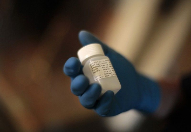 Orange County Deputy Probation Officer Erin Merritt holds a canister of methadone