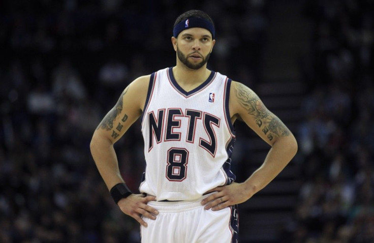 New Jersey Nets guard Deron Williams prepares for the third quarter of their NBA basketball game against Toronto Raptors in London