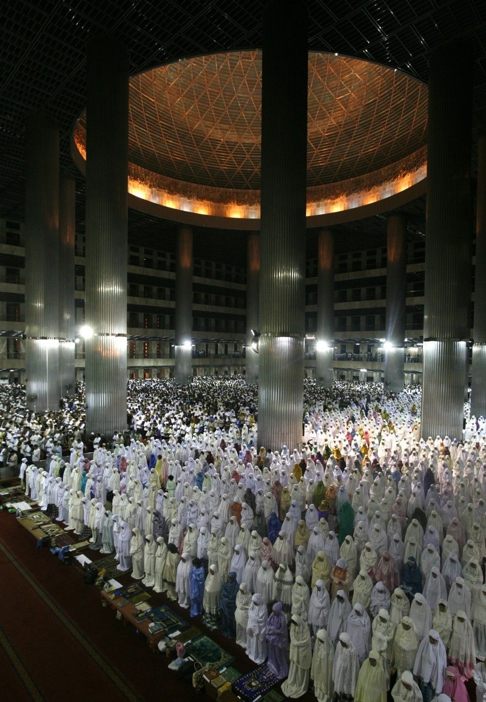 Muslims attend mass prayer session quotTarawihquot, which marks the beginning of the holy fasting month of Ramadan, at Istiqlal mosque in Jakarta