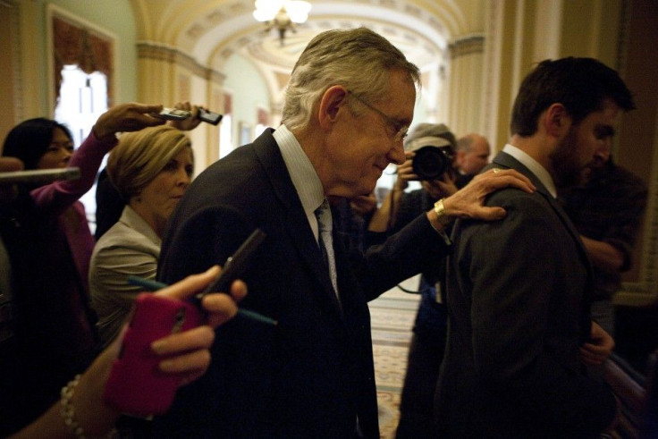 US Senate Majority Leader Reid walks from a meeting with Senate Minority Leader McConnell on the debt ceiling crises on Capitol Hill in Washington