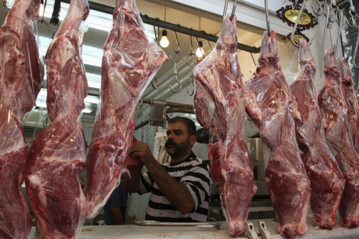 A butcher prepares meat in downtown Amman July 28, 2011, ahead of the fasting month of Ramadan. 