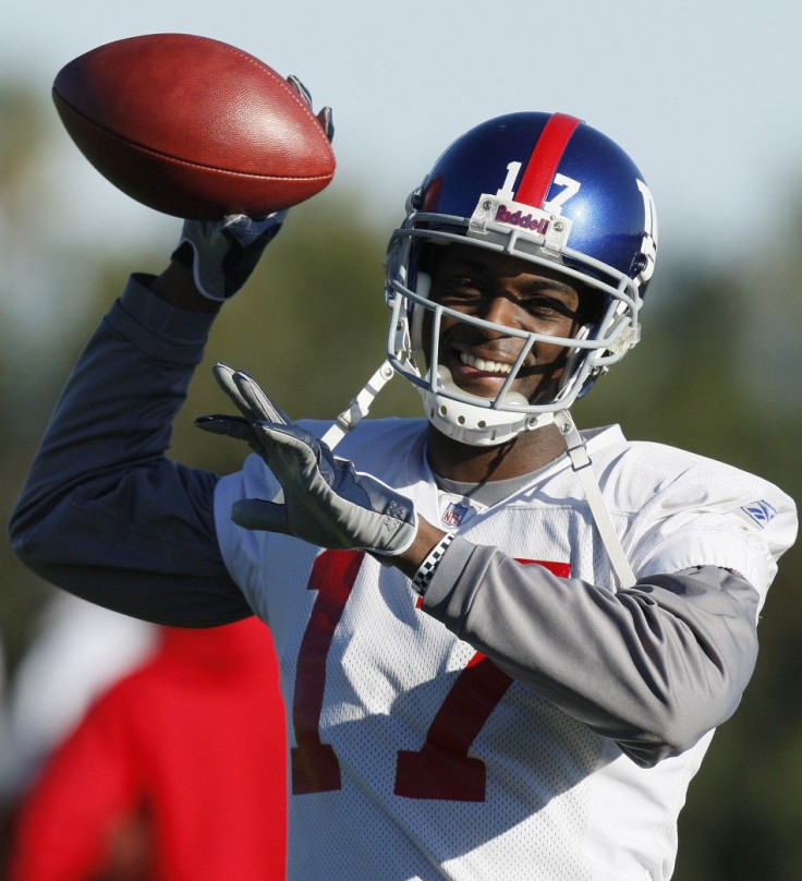 New York Giants wide receiver Plaxico Burress throws during practice for their upcoming National Football League (NFL) Super Bowl game against the New England Patriots in Tempe