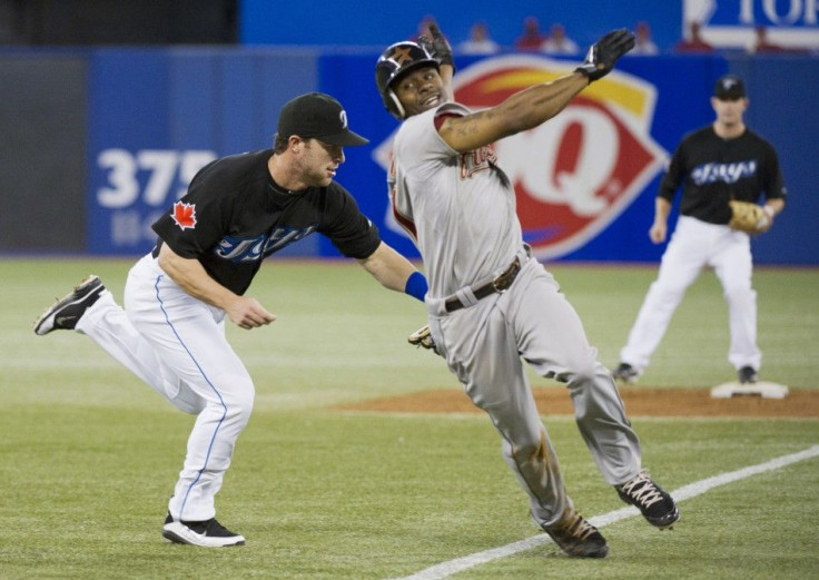 Blue Jays third baseman Nix tags Bourn out at third base during their Interleague MLB baseball game in Toronto