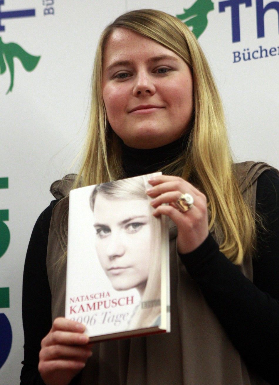  Austrian kidnap victim Natascha Kampusch poses with her book 3,096 Days during a photo call in a bookstore in Vienna