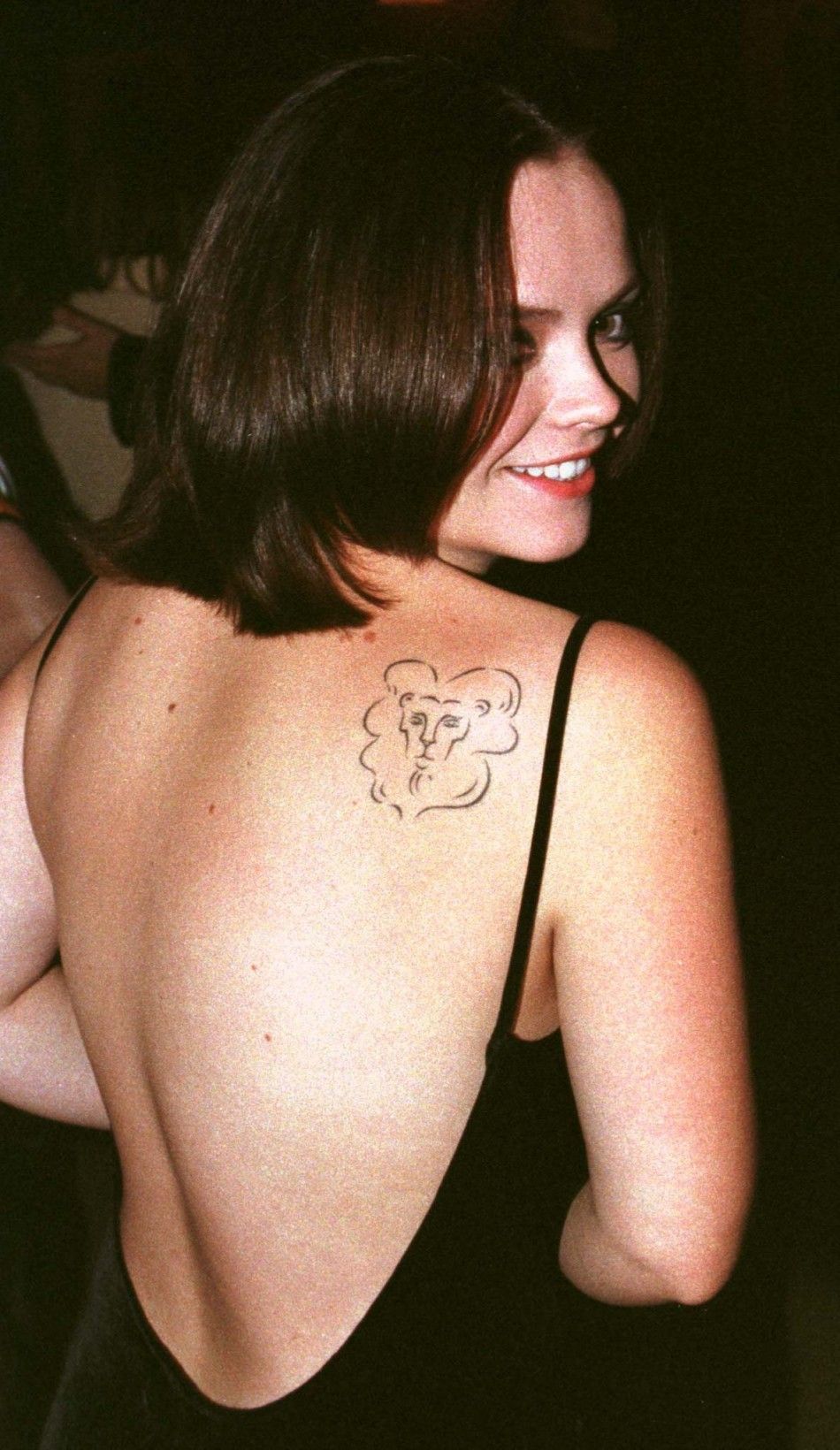 Actress Christina Ricci shows off her tattoo of a lions head at the premiere of her new film quotPecker,quot September 22 in Santa Monica.