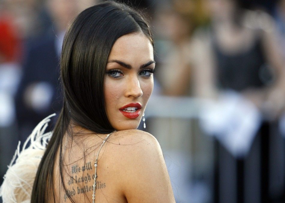Megan Fox poses at the premiere of Transformers at the Manns Village theatre in Los Angeles