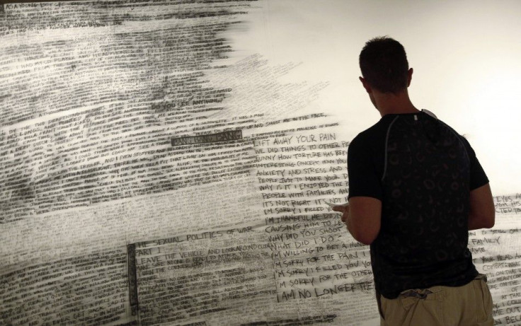 A man looks at an art exhibit at the National Veterans Art Museum in Chicago