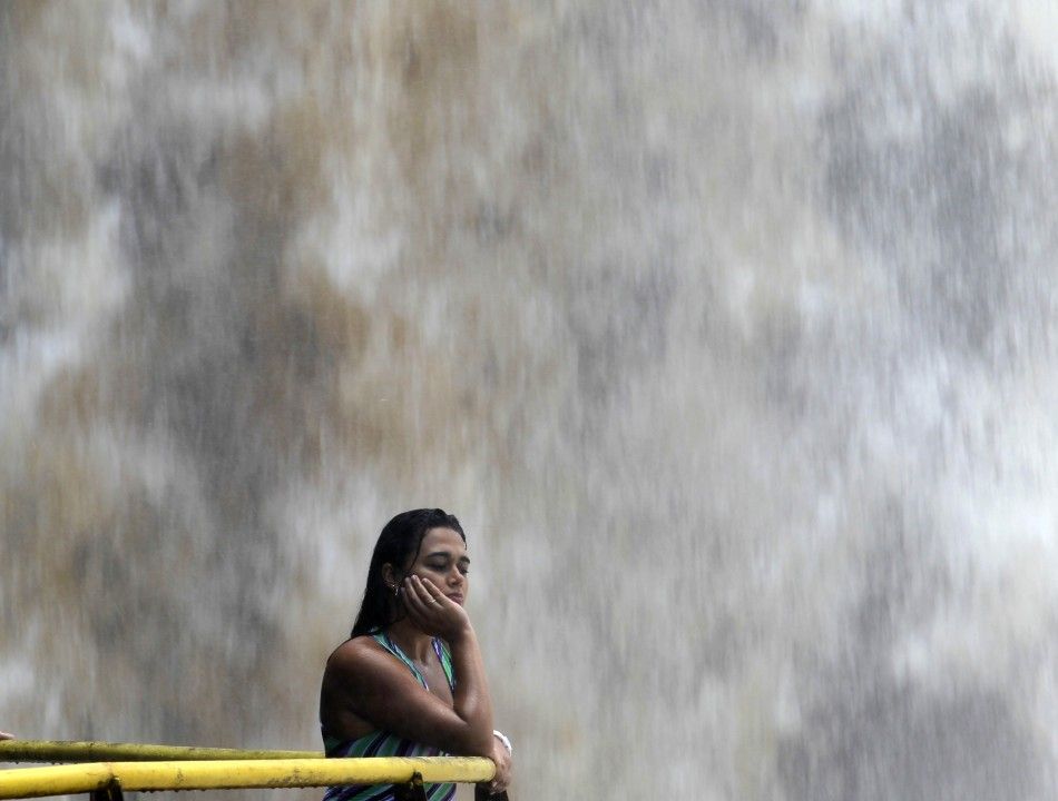 A tourist watches the Iguazu Falls from a viewing point on the border of Argentina039s province of Misiones and Brazil039s State of Parana.