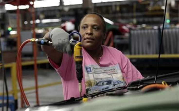 United Auto Workers union member assembly worker Ingrid Hill works on a Chevrolet Volt electric vehicle at General Motors' Detroit-Hamtramck assembly plant