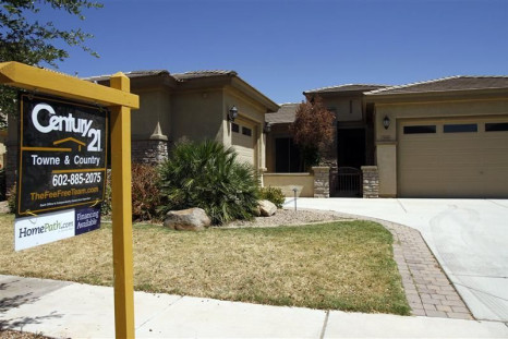 A real estate for sale sign is displayed outside a home in Chandler Heights, Arizona