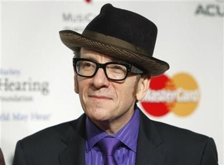 British recording artist Elvis Costello arrives at the 2011 MusiCares Person of the Year tribute honoring Barbra Streisand in Los Angeles, February 11, 2011.