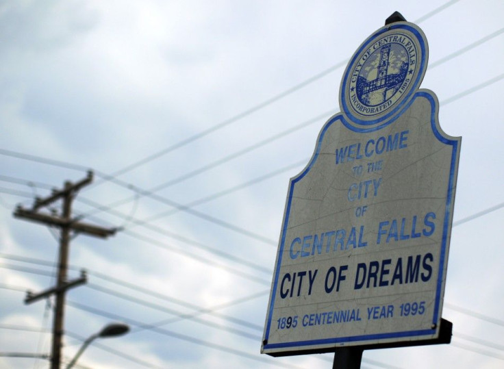 A sign calling Central Falls, Rhode Island a &quot;City of Dreams&quot; marks the town&#039;s boundary on Higginson Avenue