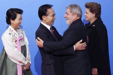 South Korea's President Lee Myung-bak (2nd L) and his wife Kim Yoon-ok (L) greet Brazil's President Luis Inacio Lula da Silva and President-elect Dilma Rouseff (R) as they arrive at the National Museum of Korea for dinner in Seoul November 11, 2010, on th