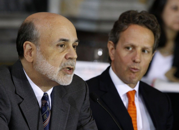 U.S. Treasury Secretary Geithner listens to Chairman of the Federal Reserve Bernanke in Washington