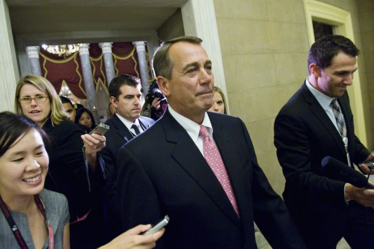 Boehner returns to his office after the vote on debt relief legislation at the U.S. Capitol in Washington