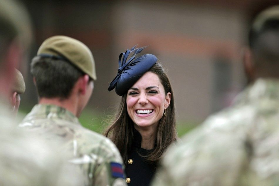 Britains Catherine, Duchess of Cambridge speaks with soldiers during a medal ceremony for the Irish Guards at the Victoria Barracks in Windsor