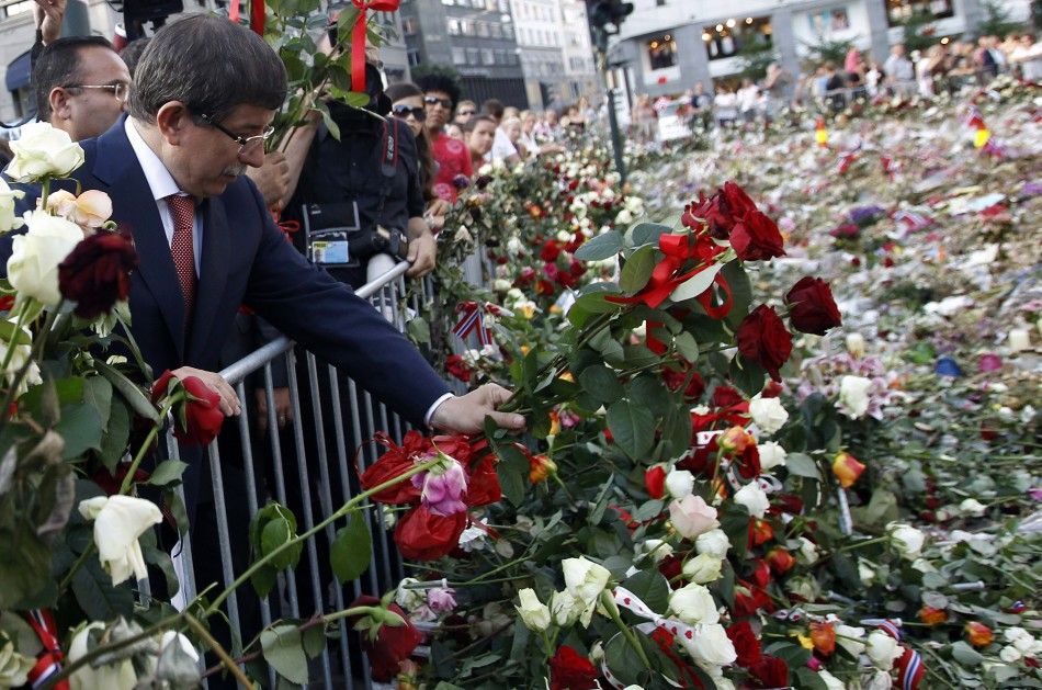 Turkey039s Foreign Minister Ahmet Davutoglu lays flowers outside the Oslo cathedral