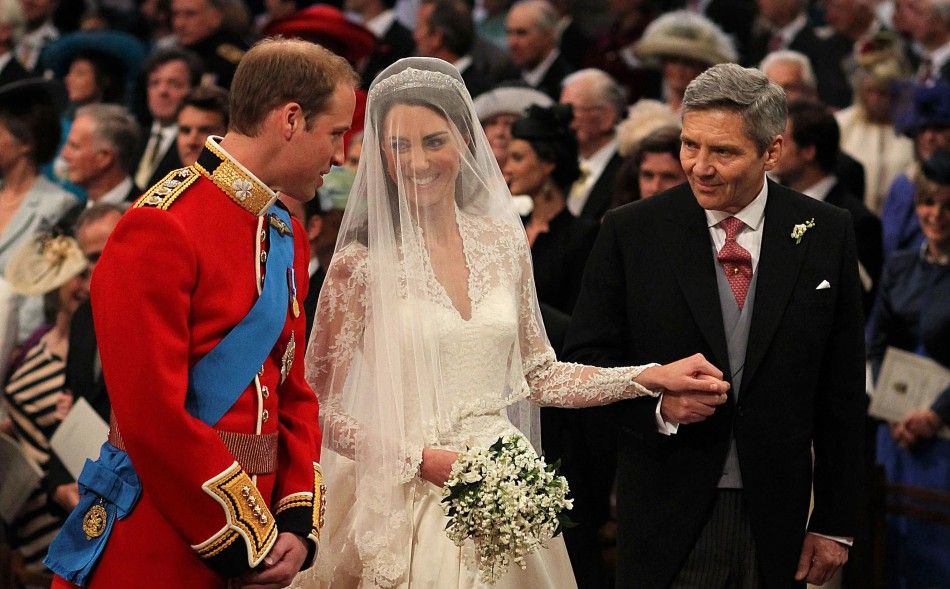 Britain039s Prince William stands at the altar with his bride, Kate Middleton, and her father Michael, during their wedding at Westminster Abbey in central London