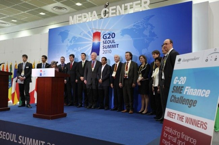 Winners of the SME finance challenge line up at the G20 Seoul Summit media center at the COEX convention center on November 12, 2010. 